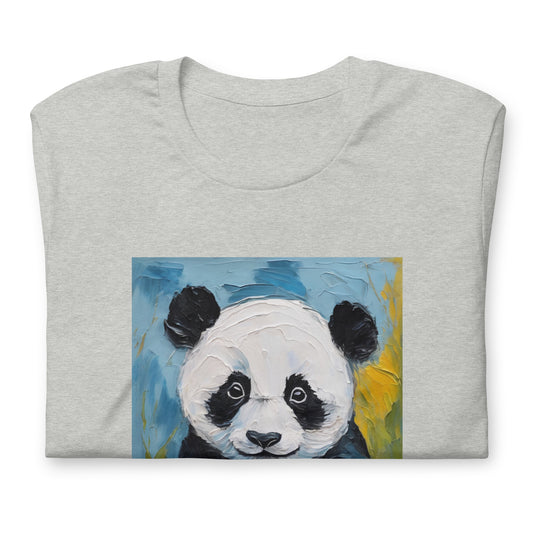 Close up of a grey cotton t-shirt with an oil-painting-style panda graphic, featuring a cute panda against soft blue brushstroke sky and yellow floral accents.