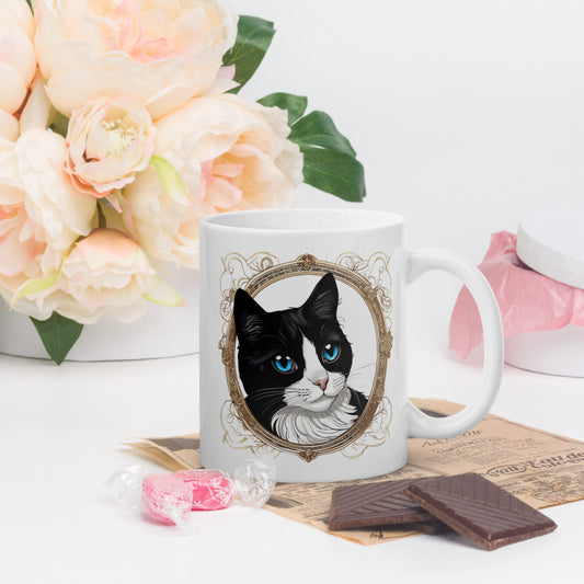 Tuxedo cat tea cup featuring an elegant tuxedo cat design, placed on a table with a pot of beautiful flowers in the background - a perfect tuxedo cat gift.