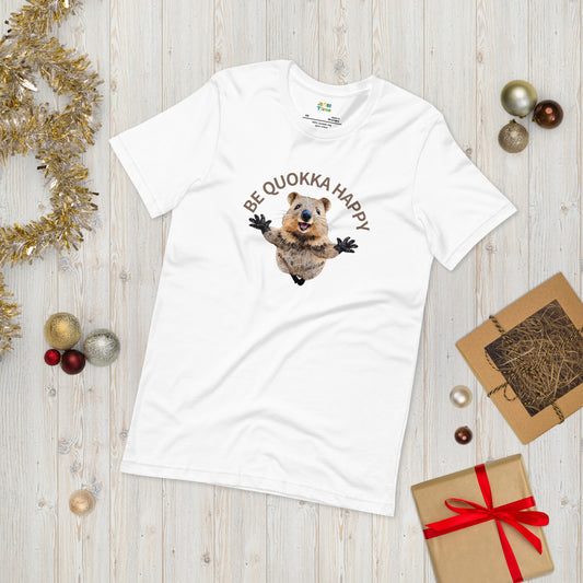 A white cotton T-shirt with a Happy Quokka graphic, neatly laid flat on a table.