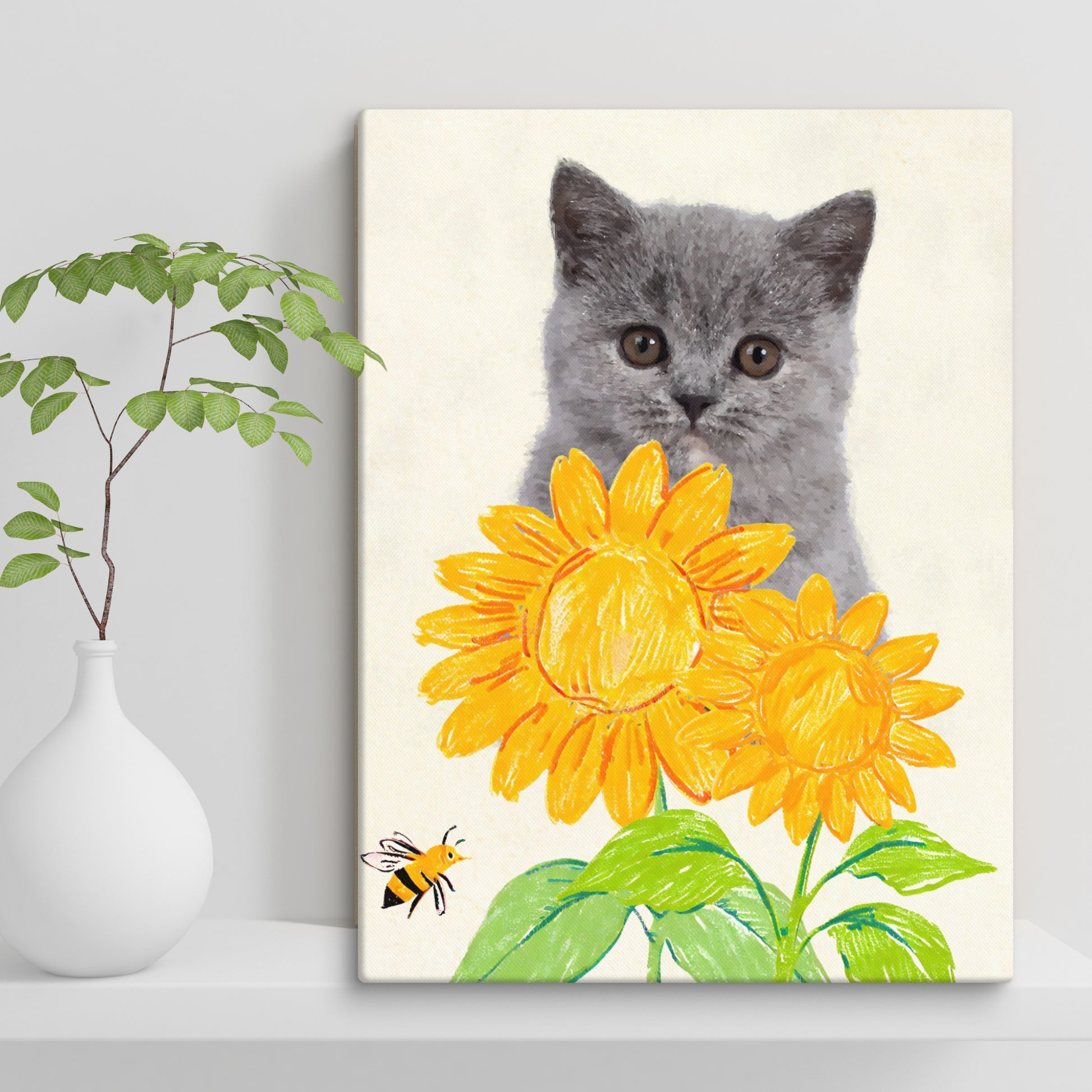 Minimalist pet portrait of a gray kitten with wide, expressive eyes in soft watercolor style, framed by two bright crayon-style sunflowers and a bee near the corner, displayed on a white shelf beside a green potted plant.