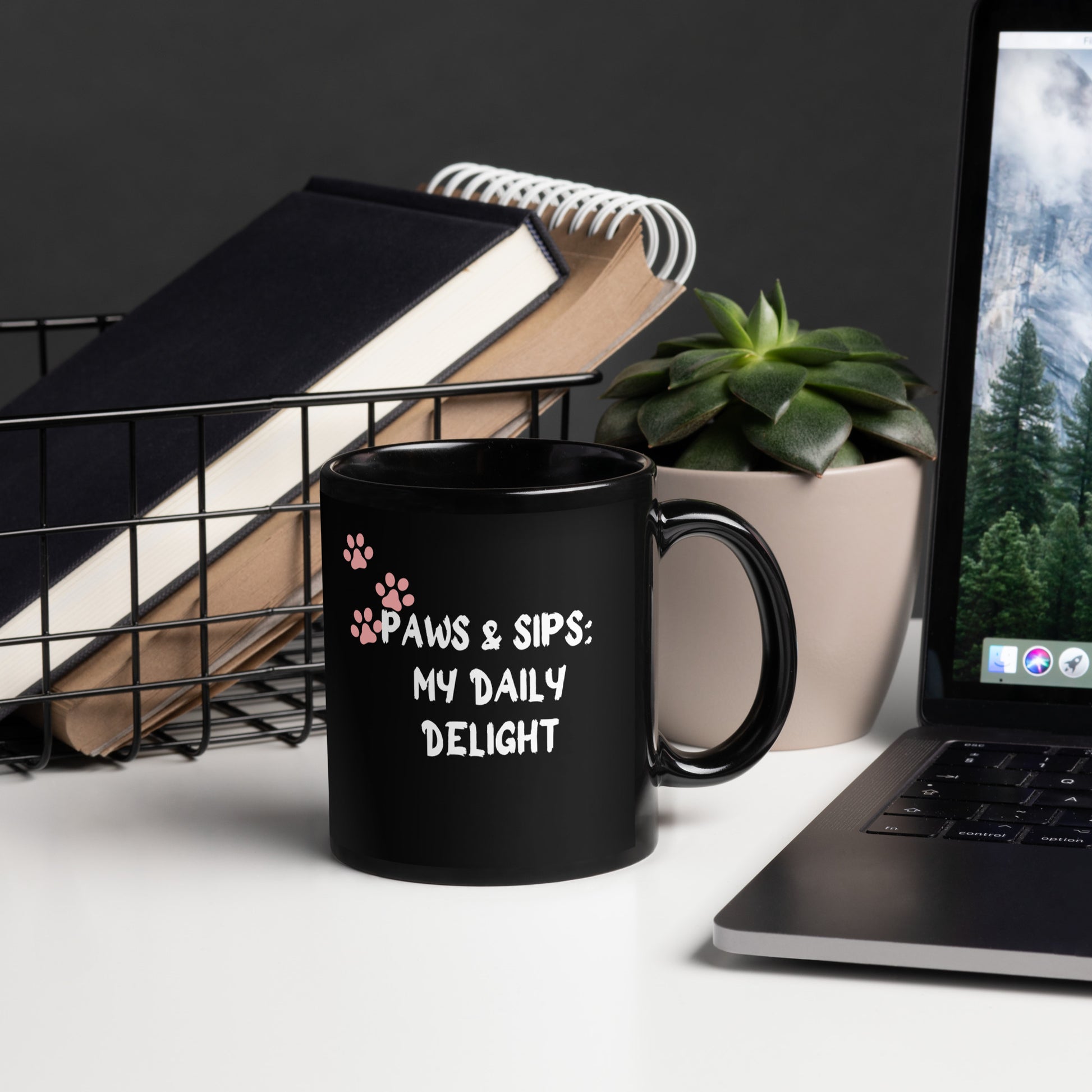 A sleek black coffee mug adorned with a delightful message, elegantly resting on an office table.