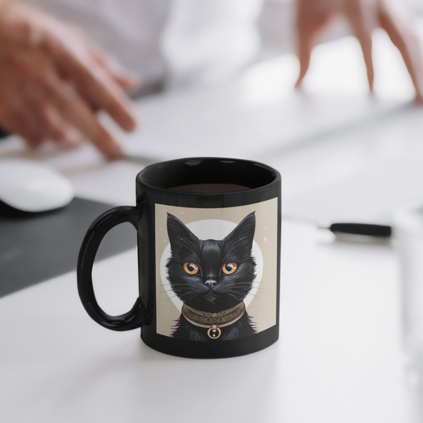 A sleek black coffee mug with a whimsical black cat illustration on one side, resting on an office table.