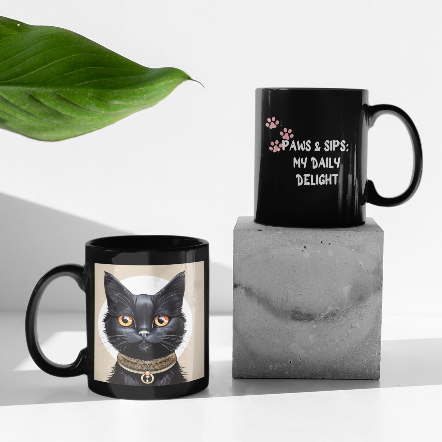 A pair of sleek black coffee mugs with whimsical black cat illustrations on one side and delightful printed messages on the other, elegantly displayed on a modern table.
