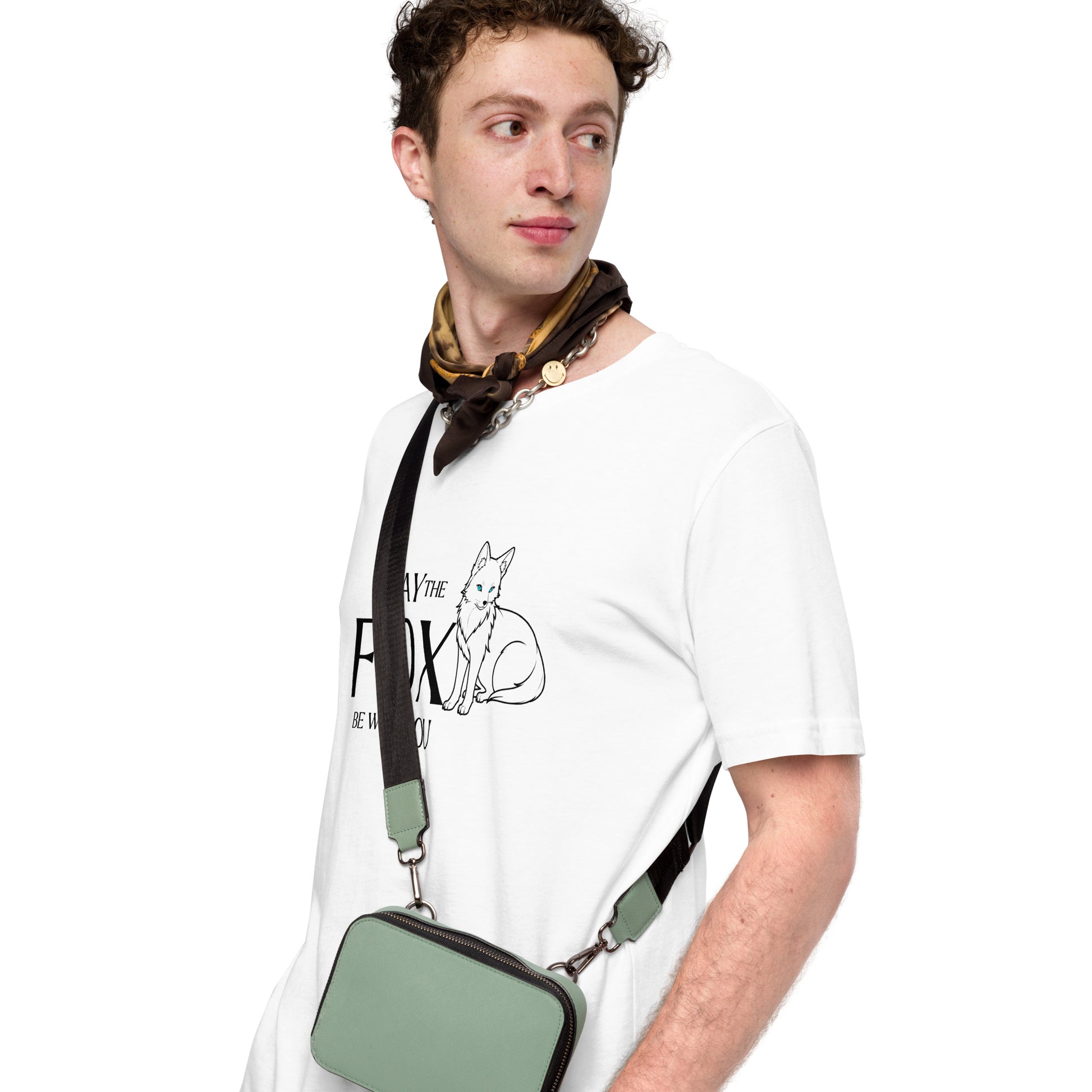 Close up view of a young man wearing a minimalist white graphic T-shirt, featuring a white fox design and the playful phrase 'May the Fox be with you.'