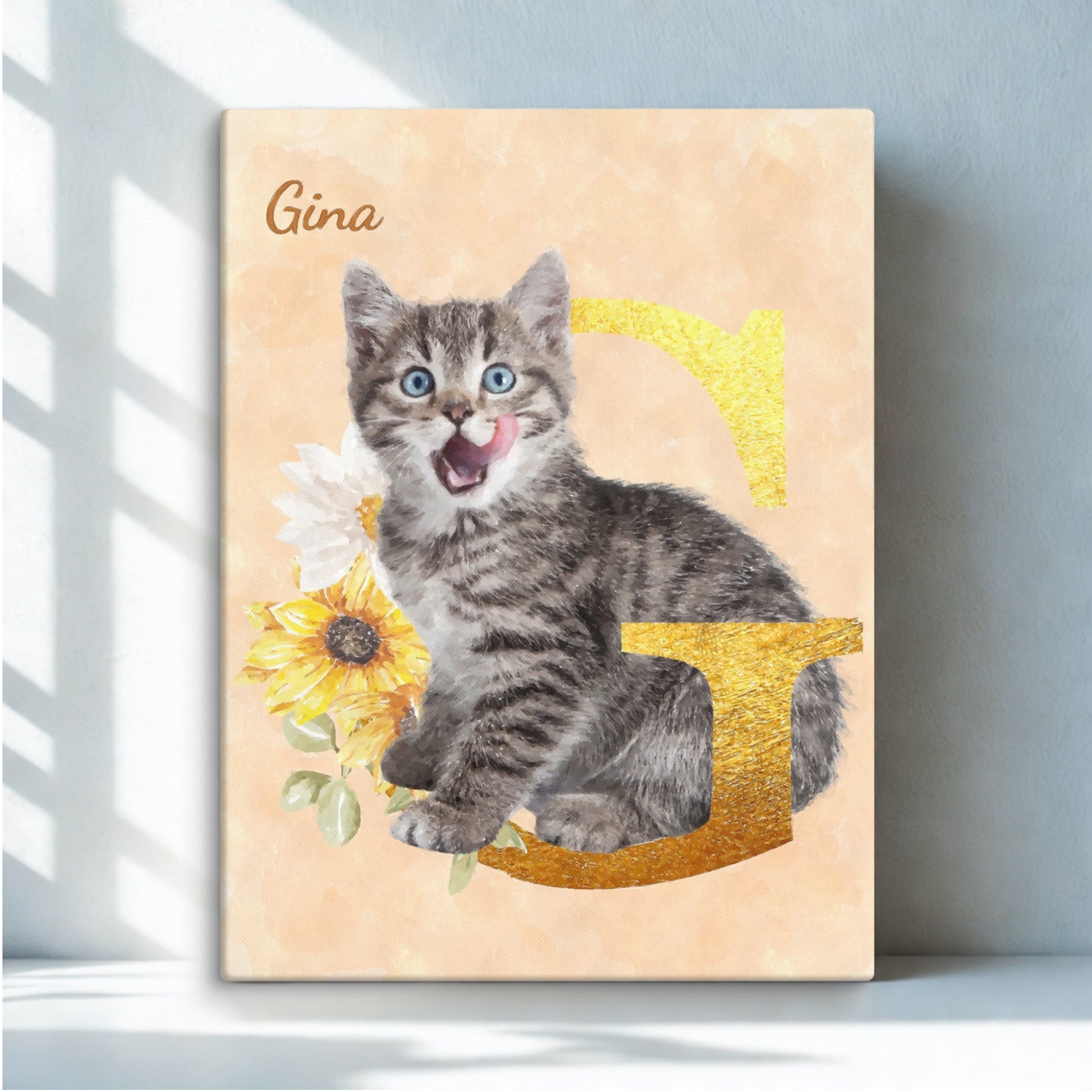 Custom watercolor cat portrait featuring a cat sitting among sunflowers on an initial 'G', displayed on a white desk.