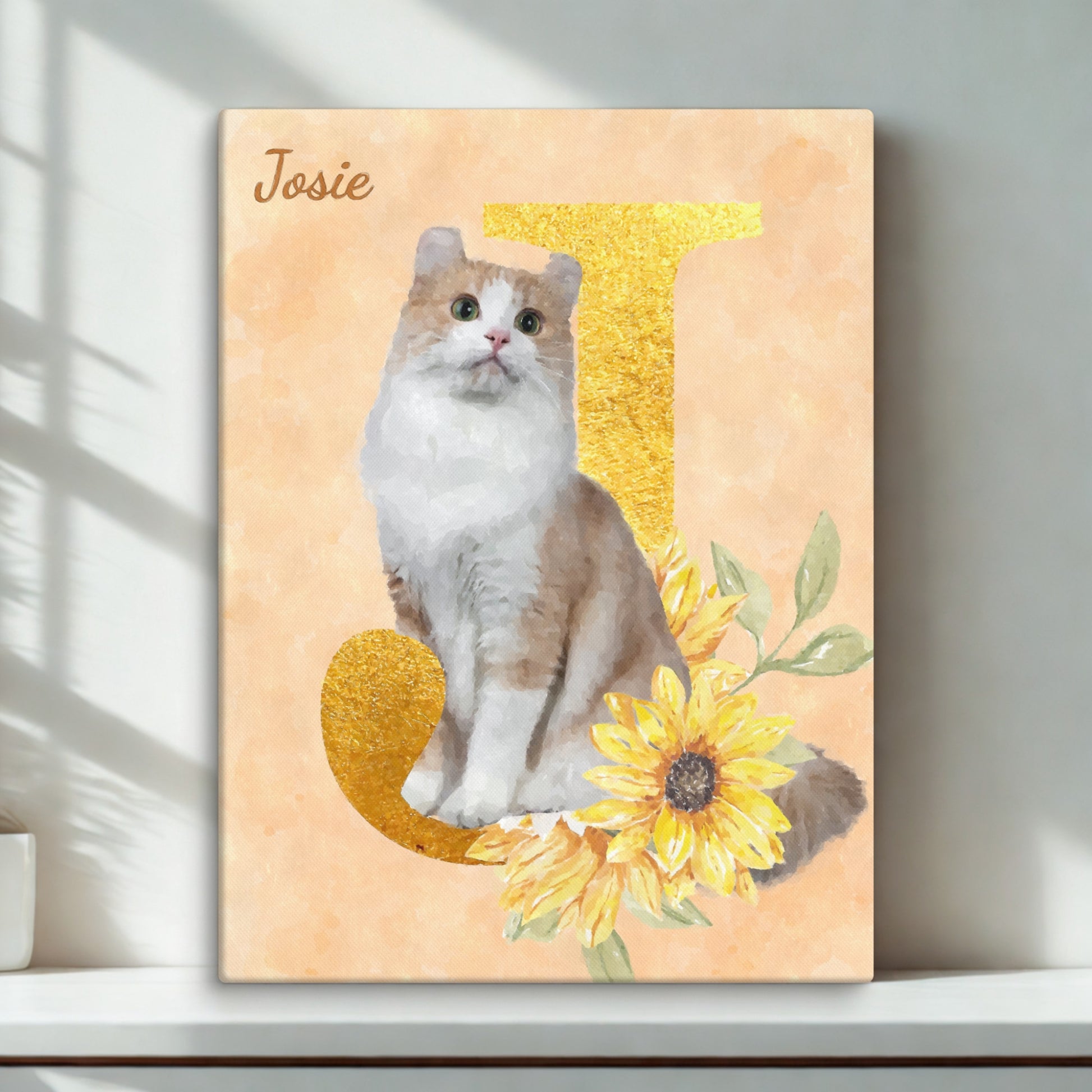 Custom watercolor cat portrait featuring a cat sitting among sunflowers on an initial 'J', displayed on a white desk.