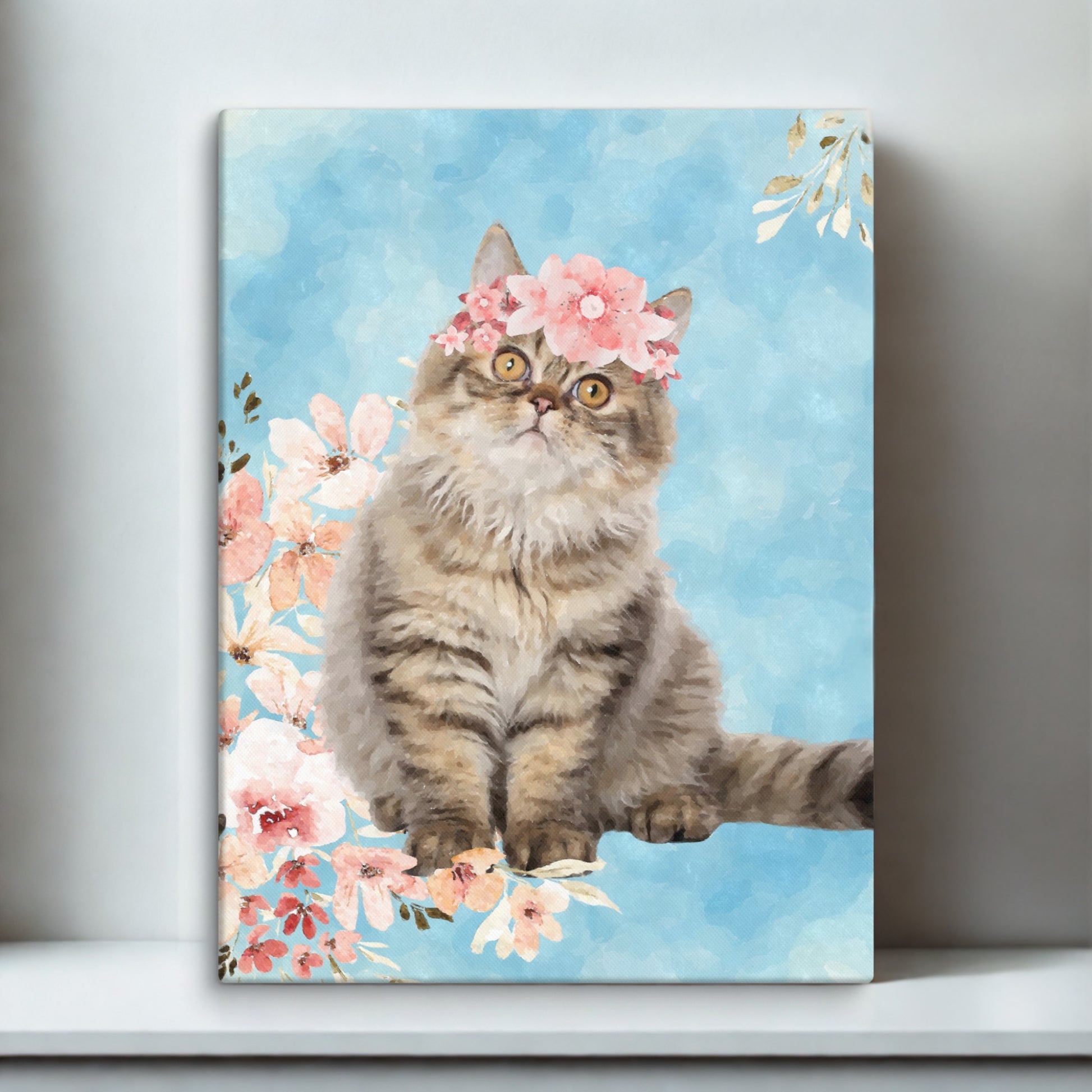 Custom watercolor portrait of a cat with soft floral accents, printed on canvas and displayed on a cozy white desk.