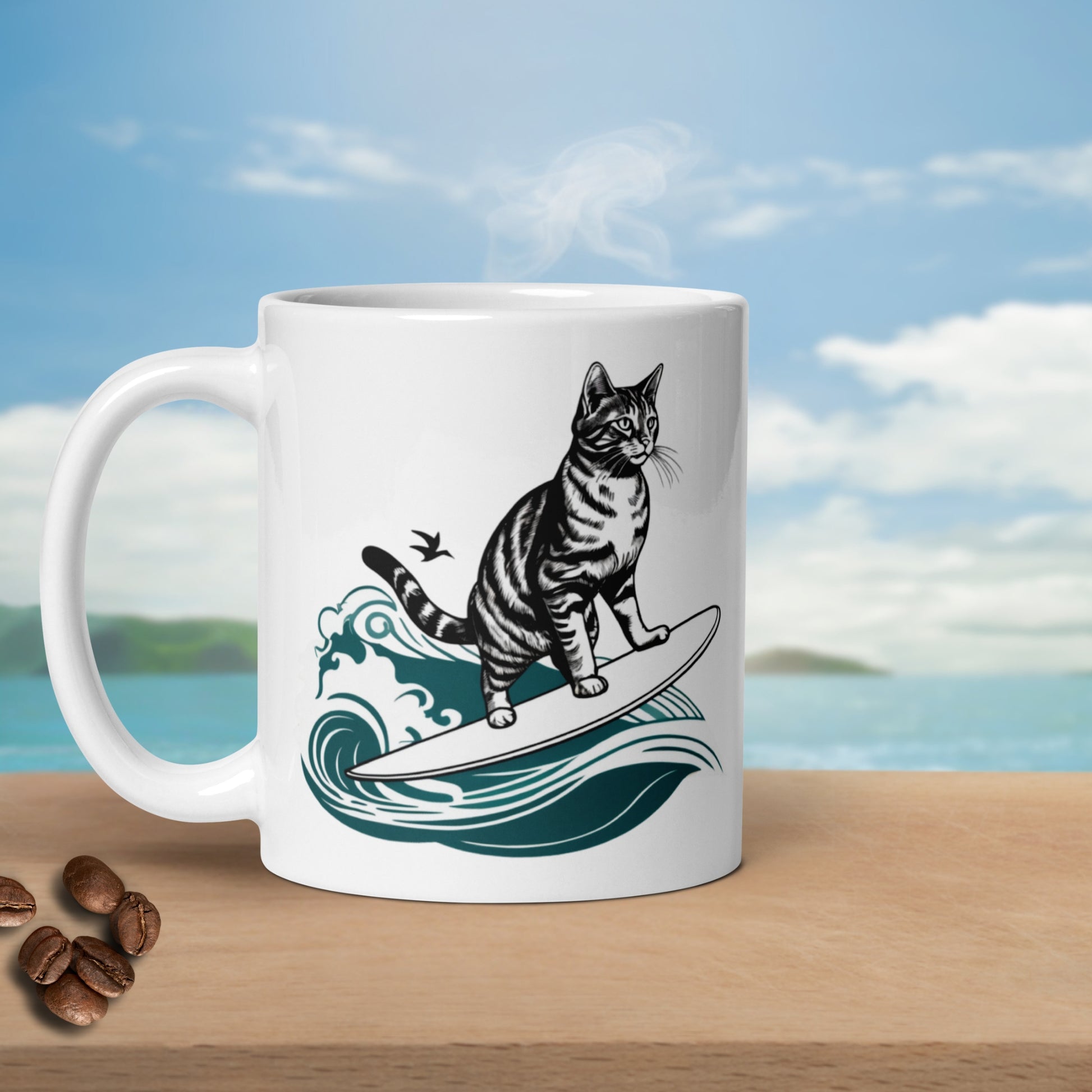 Glossy white ceramic surfing cat mug with hot steam rising, placed on a bench next to coffee beans, against an ocean backdrop. 