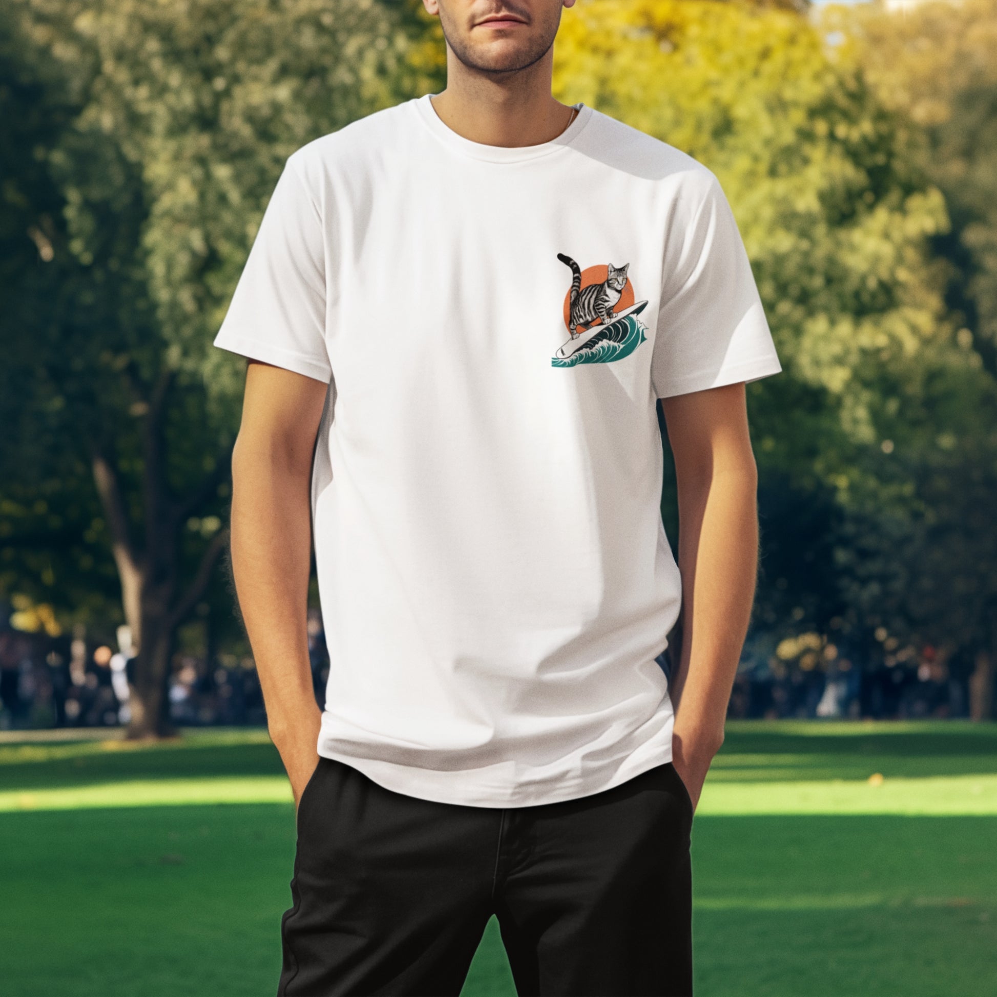 A young man wearing a white cotton minimalist graphic t-shirt featuring a small surfing cat graphic on the front left chest, ideal cat shirt for men.