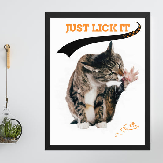 Framed modern pet portrait featuring a cat licking its paw against a minimalist background, with a playful orange tagline that reads "JUST LICK IT", accented by a black ribbon shaped like a tail and a paw print design. 