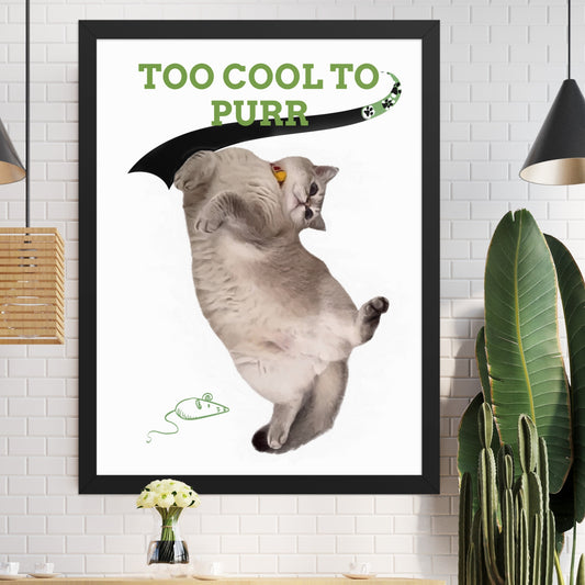 Framed poster featuring a cat against a minimalist background, with a playful green tagline that reads 'Too Cool to Purr', accented by a black ribbon shaped like a tail and a paw print design. n a white wall.