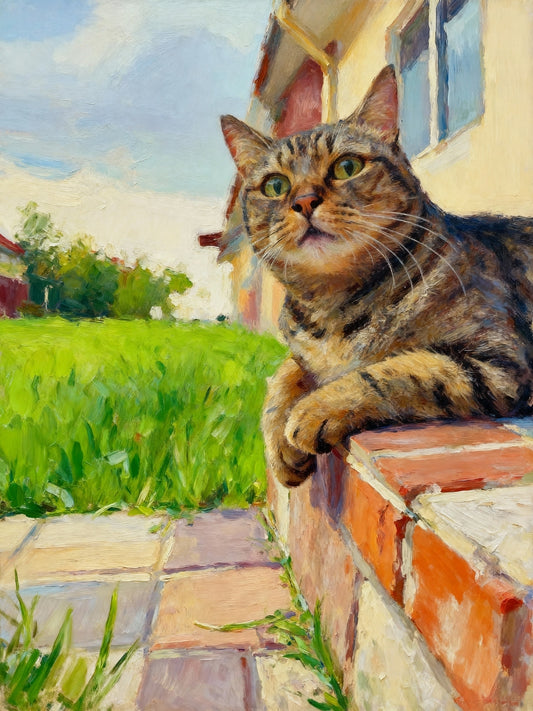 Personalized cat canvas of a tabby cat on a brick wall with a garden and house in the background