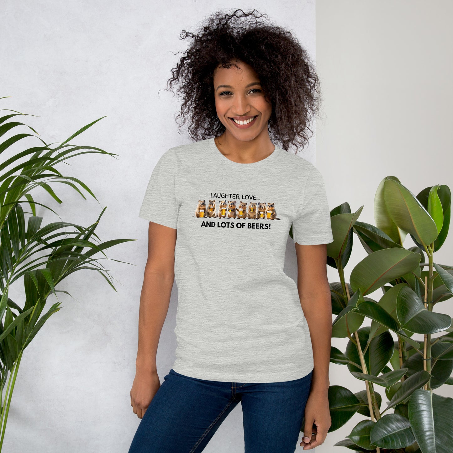 A woman wears a grey cotton T-shirt featuring a cheerful Quokka enjoying beers with friends, highlighting the fun, lively design and radiating good vibes.