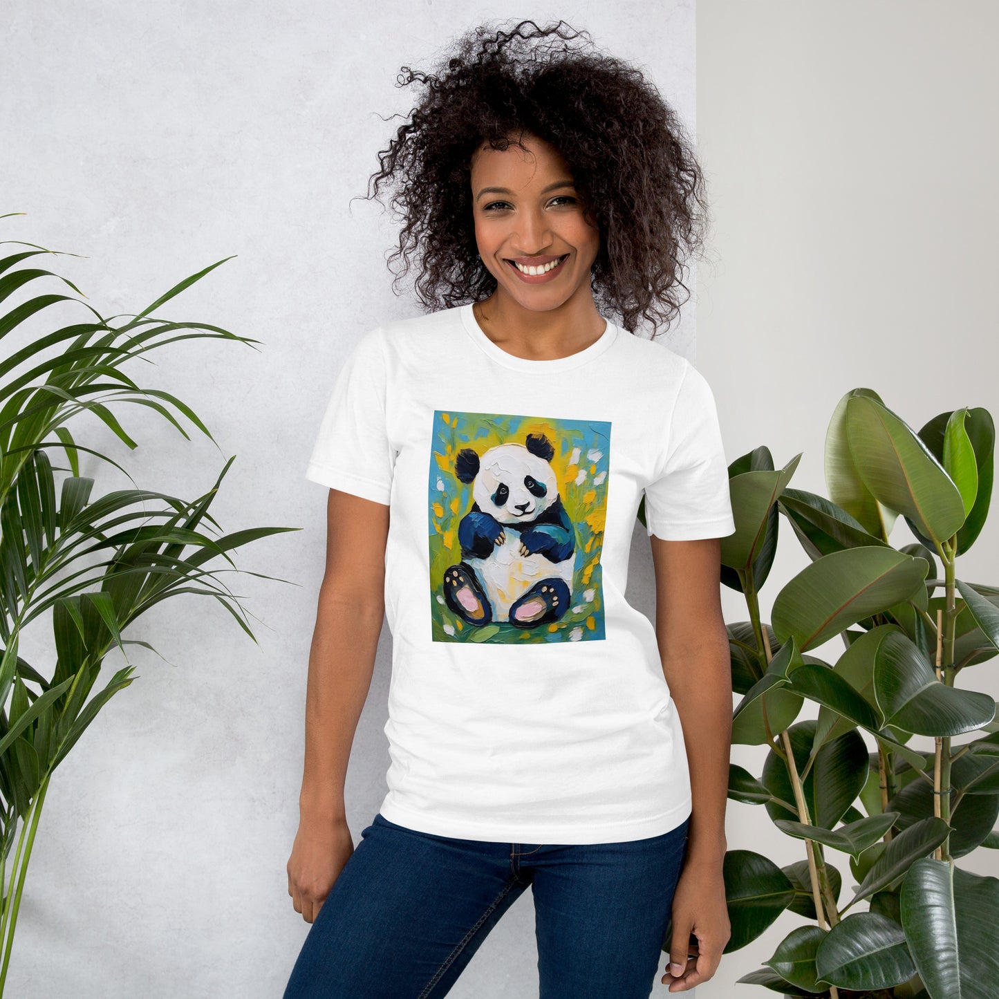 Young woman smiling in a white cotton tee featuring a oil-painting style panda surrounded by colorful floral blossoms—artistic yet cozy.