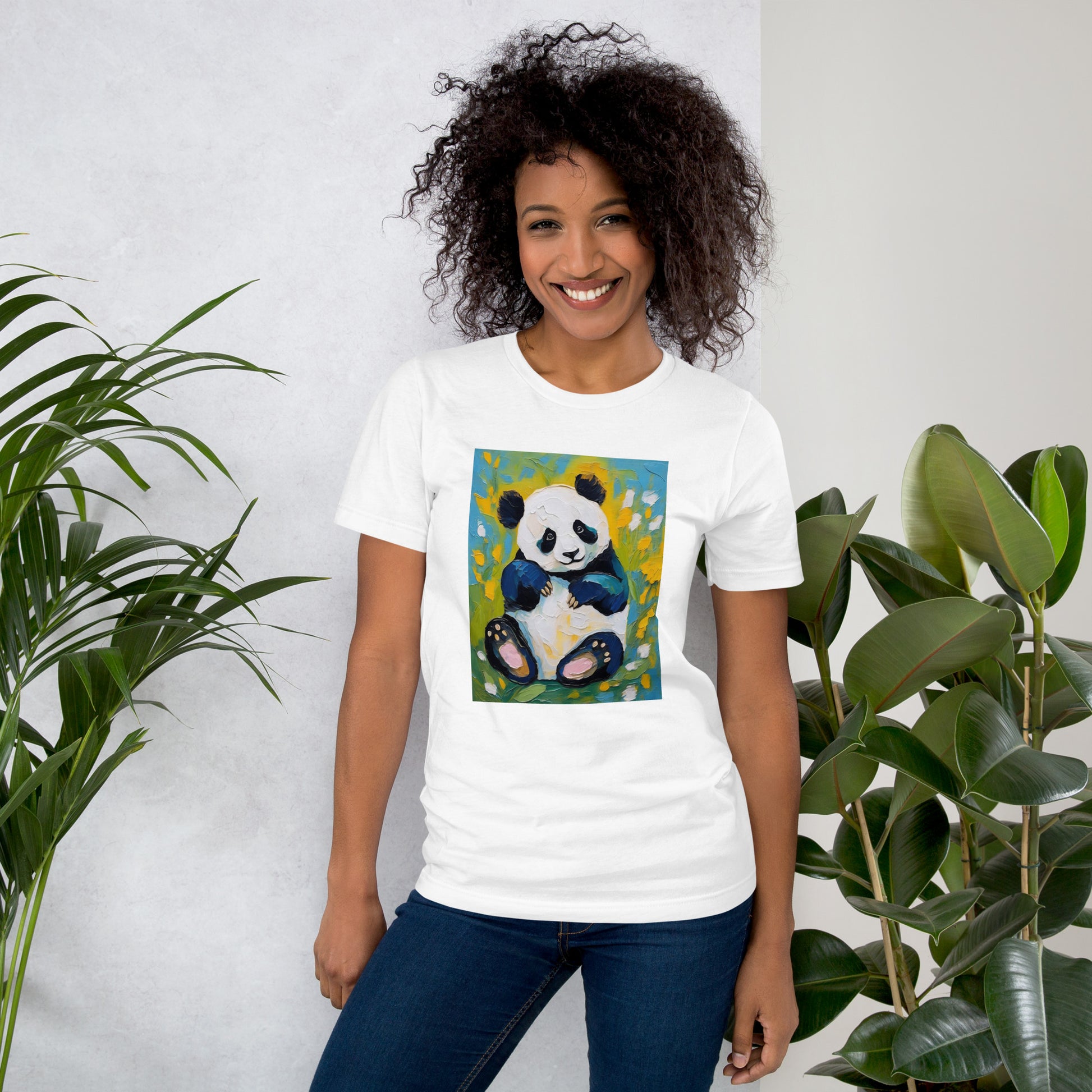 Young woman smiling in a white cotton tee featuring a oil-painting style panda surrounded by colorful floral blossoms—artistic yet cozy.