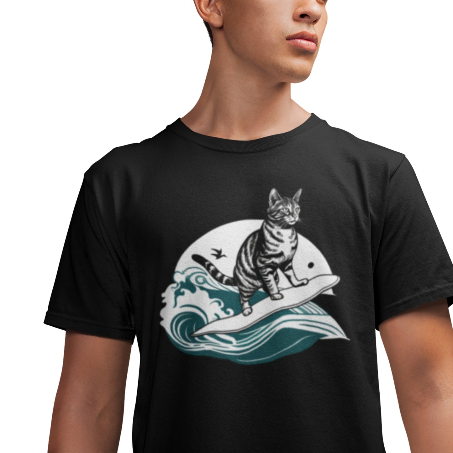 Close-up of a young man wearing a black cotton T-shirt with a cool surfing cat design.