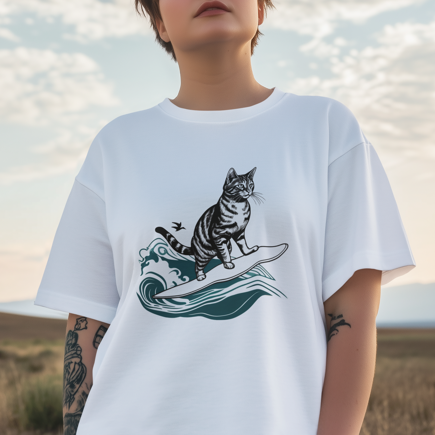 Close-up of a young woman wearing a white cotton T-shirt with a cool surfing cat design.